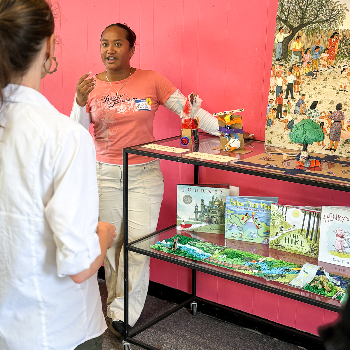 Noa presenting a mapping and nature display at a playshop