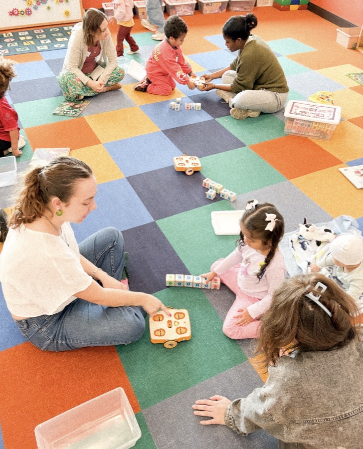 McKenna facilitating a robotics activity with children
